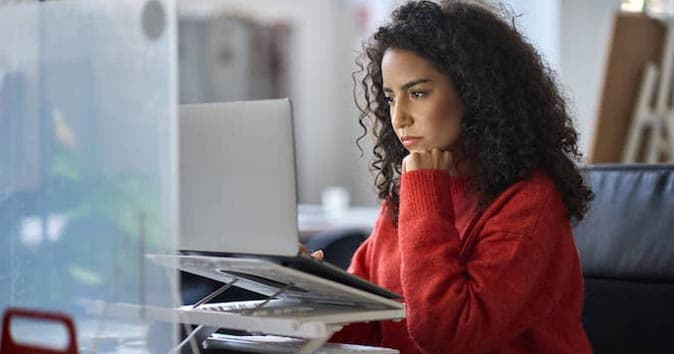 Women sitting and looking at the screen