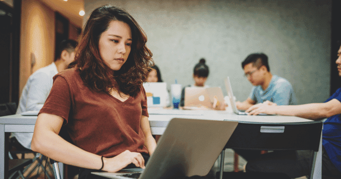 An Asian female employee answering corporate diversity and inclusion survey questions