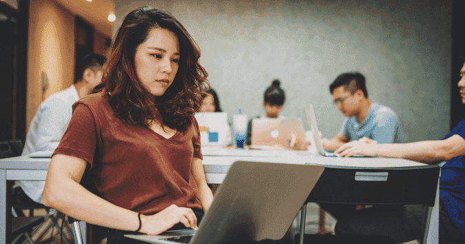 An Asian female employee answering corporate diversity and inclusion survey questions