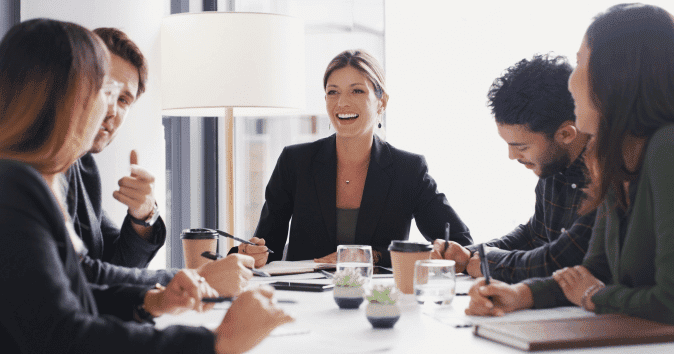 team members creating a diversity and inclusion survey template during a meeting