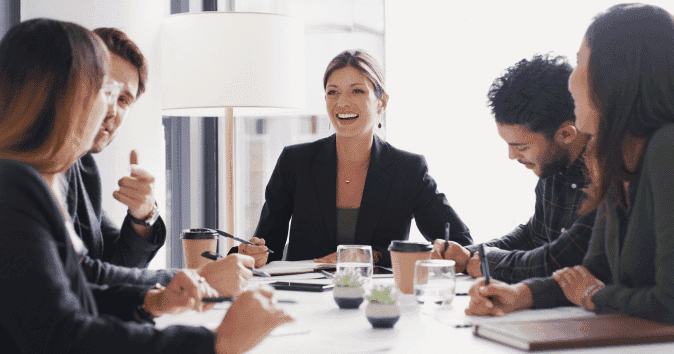 team members creating a diversity and inclusion survey template during a meeting