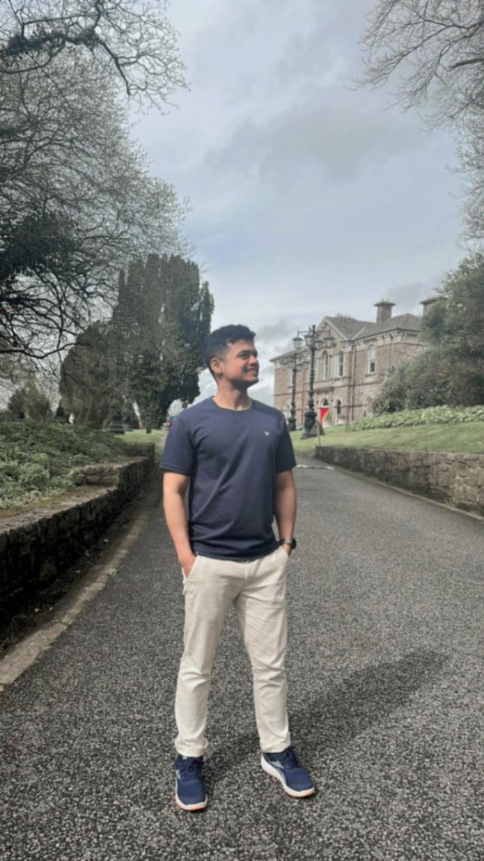 man-standing-outside-house-smiling