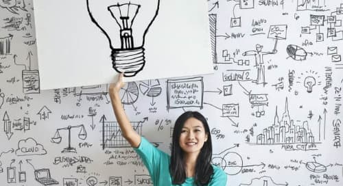 coworker holding up lightbulb signifying employee productivity