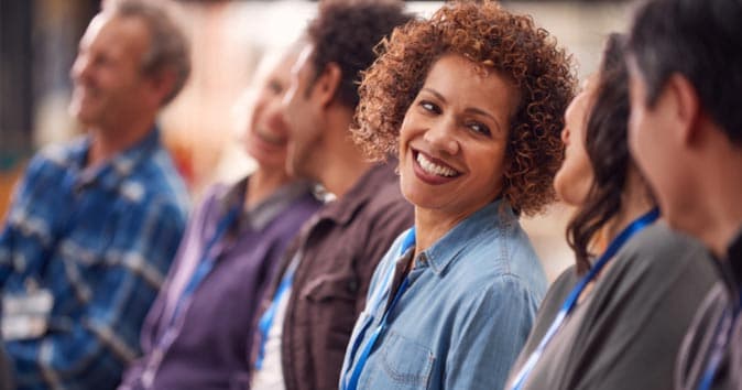 two women looking at each other smiling and talking
