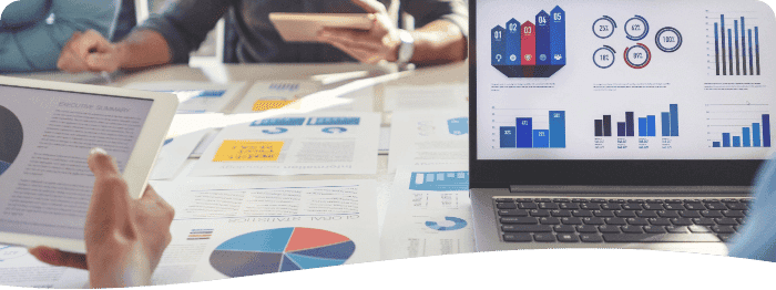 a table covered with printout of charts