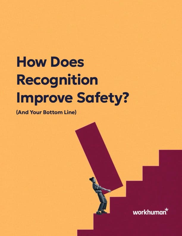 A graphic featuring a stylized illustration of a person in business attire pushing a large red block up some stairs, symbolizing progress or effort. Above the image, the text reads, "How Does Recognition Improve Safety? (And Your Bottom Line)" with the Workhuman logo at the bottom right corner. The background is a solid yellow color, which emphasizes the main elements of the design.