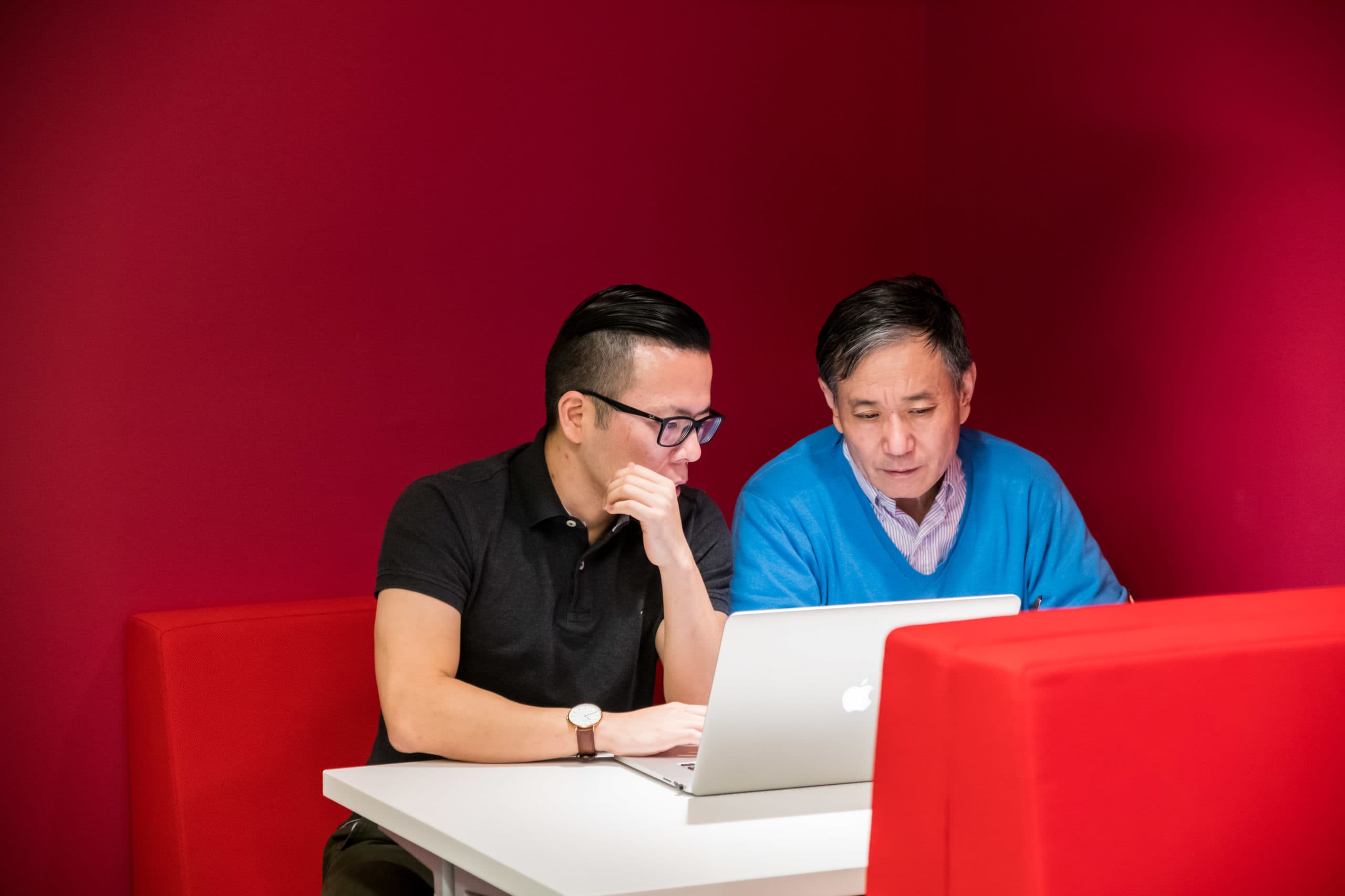 People consulting together at booth