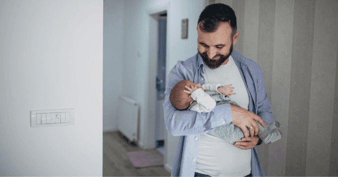 dad holding baby