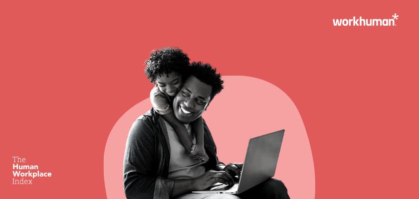 mom on a laptop being hugged around the neck by a kid