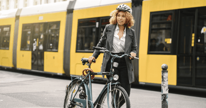 An employee uses public transport and a bicycle to commute to work