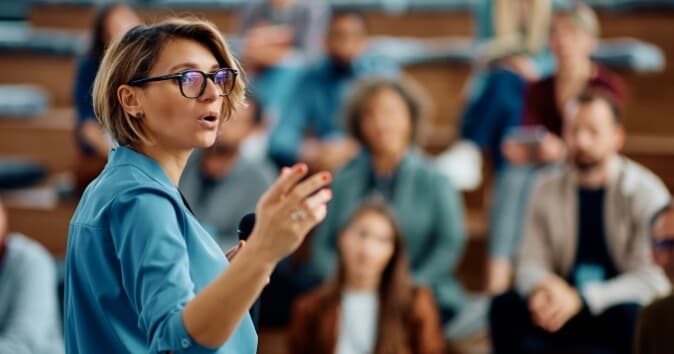 Woman speaking to an audience.