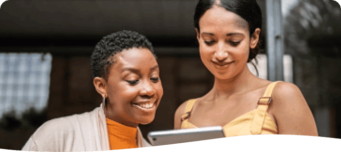 co workers looking at ipad