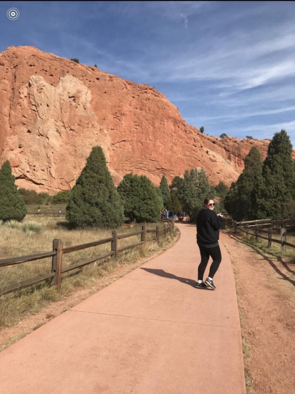 Kristin Krom hiking a mountain