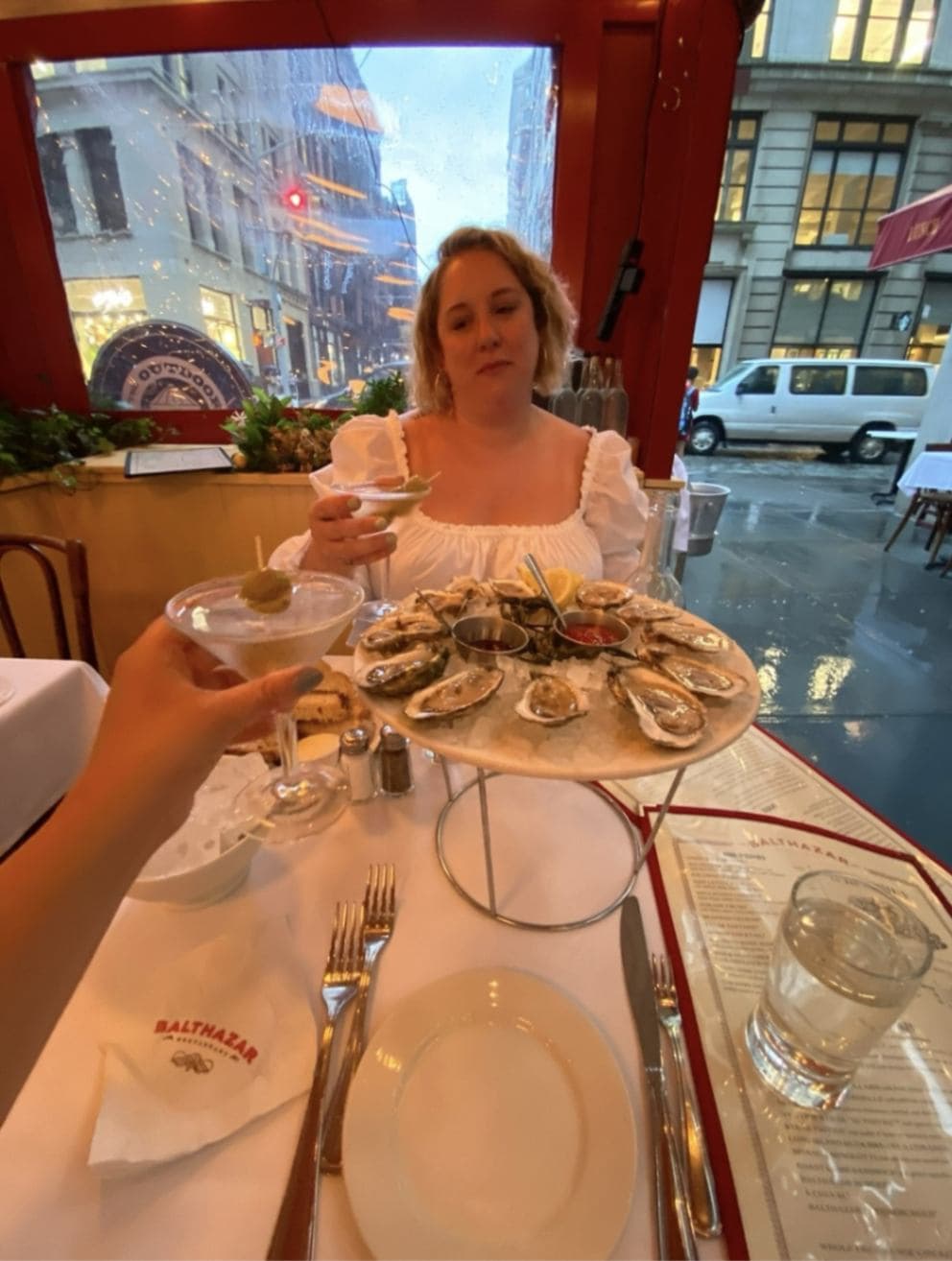 Kristin Krom out in a restaurant with cocktails and oysters