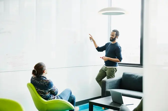Employees contributing in a meeting about workplace wellness programs