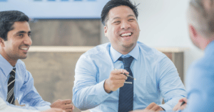 three men in business attire meeting