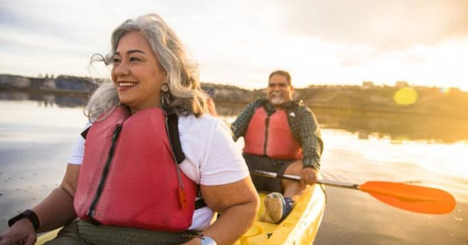 a couple with gray hair in a kayak