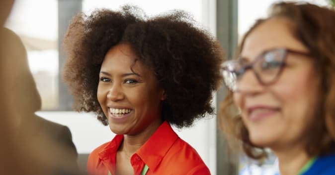 coworkers discussing emotional intelligence activities during a team meeting