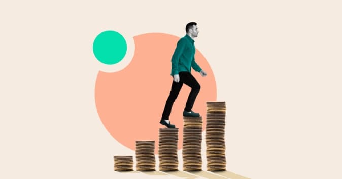 Man walking up stacks of coins.