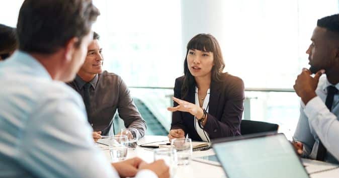 senior employee leads a meeting about employee development plans, emphasizing the importance of investing in the growth and success of employees