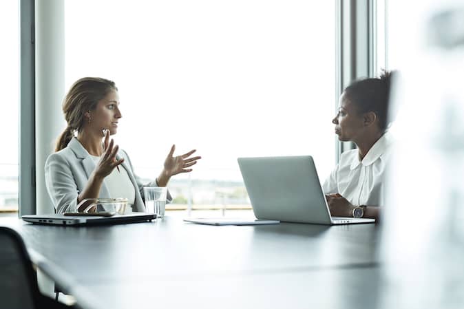 Employees discussing with each other