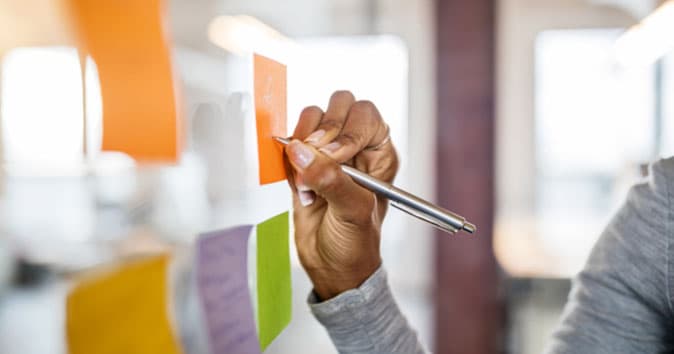 An employee planning their work showing they are committed to the goal