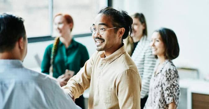 Two men greeting each other