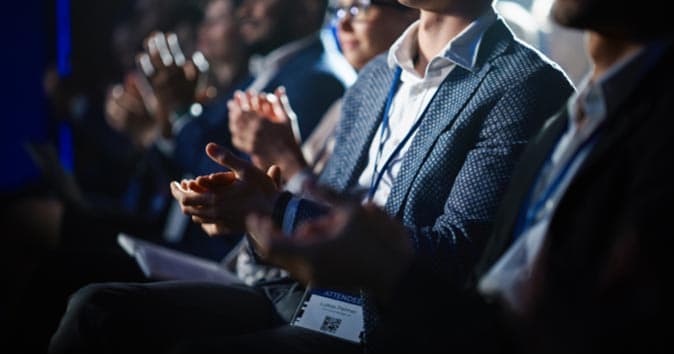 Professionals clapping in the seminar