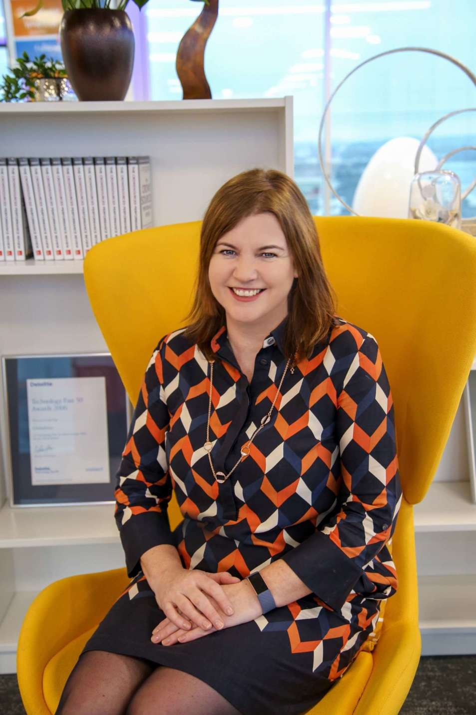 Michelle McDaid sitting in yellow chair