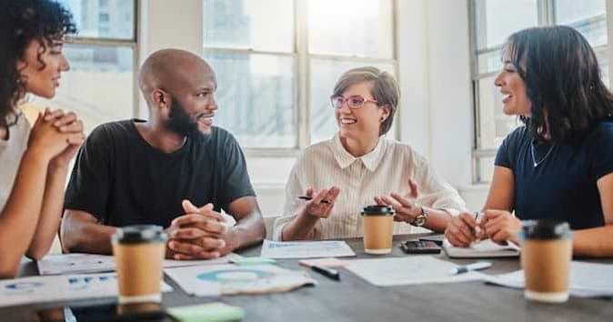 People sitting around the table and discussing