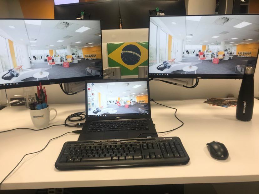 laptop connected to two monitors