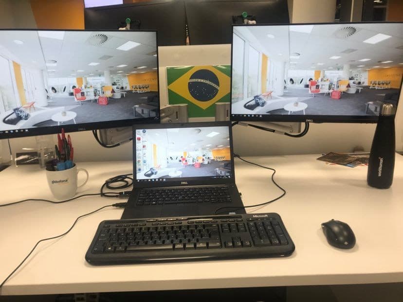 laptop connected to two monitors