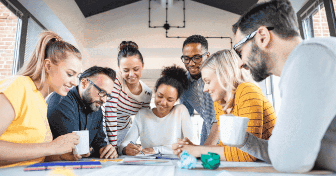 a group of employees playing a quick team-building game indoor