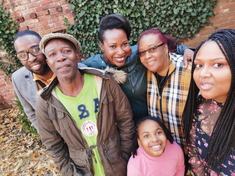 group photo of misha ann and family
