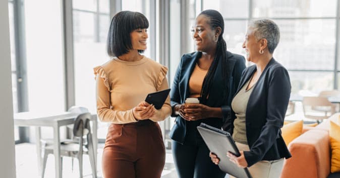 Group of females standing together and talking