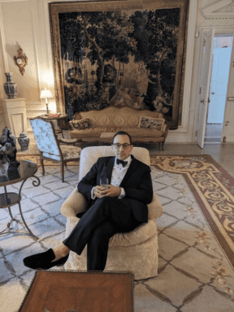 man-sitting-down-wearing-a-tuxedo