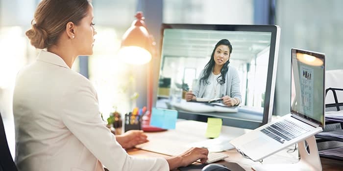 manager and employee meeting virtually to discuss performance