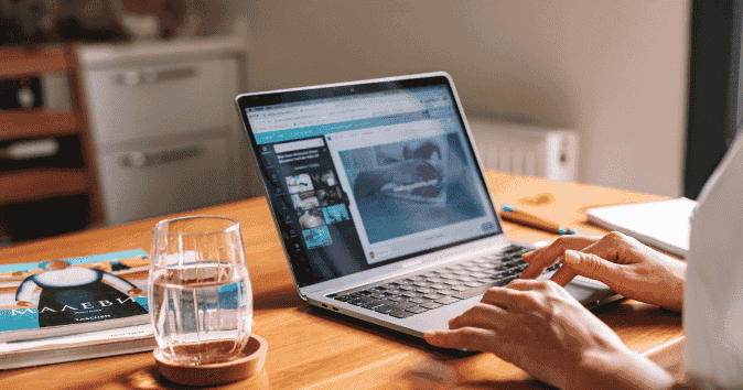 an employee sharing screen with her team