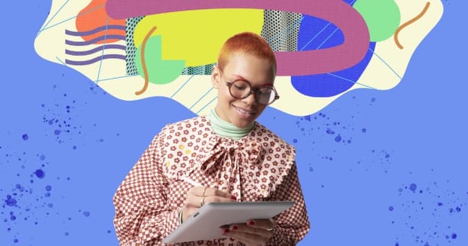 person with glasses writing