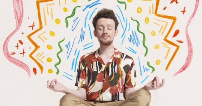 Illustration over man sitting in meditation pose.