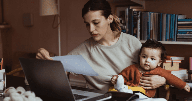 mom working with baby on lap
