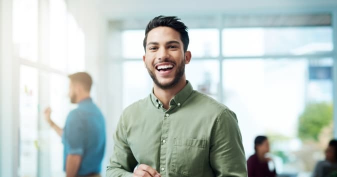 Smiling man looking at camera.