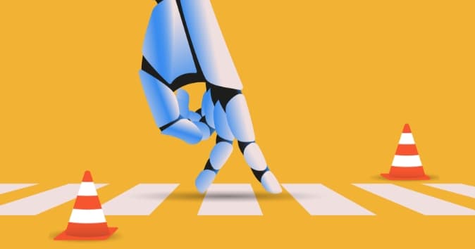 A blue robotic hand is depicted reaching out toward a pedestrian crosswalk, with orange and white traffic cones placed on either side of the crosswalk, meant to symbolize AI ethics in business. The background is a bright yellow, creating a striking contrast with the robotic arm and the cones.