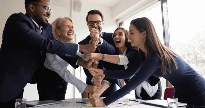 a team celebrating after getting their work done