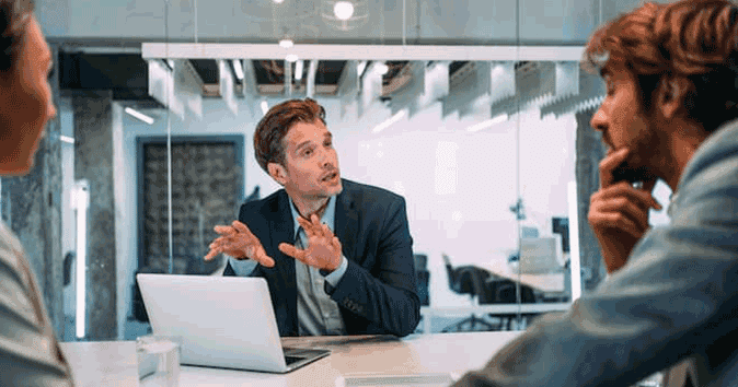 Mentor discussing leadership position and job performance